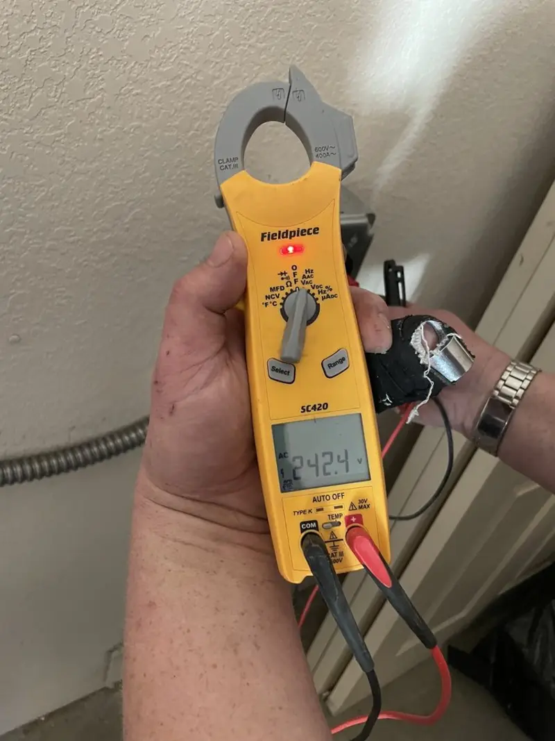 Voltage testing with clamp meter during Ceiling Fan Installation in Carrizo Springs